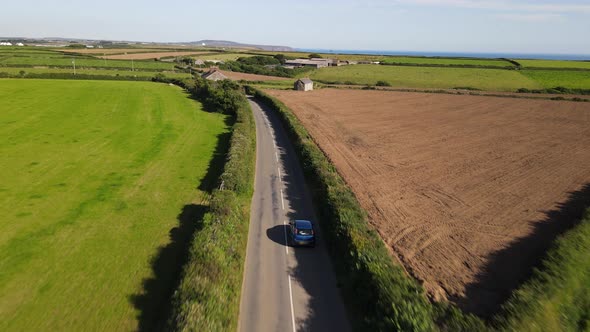 The car is moving on a country road. Outside the city through the fields. timelapse.