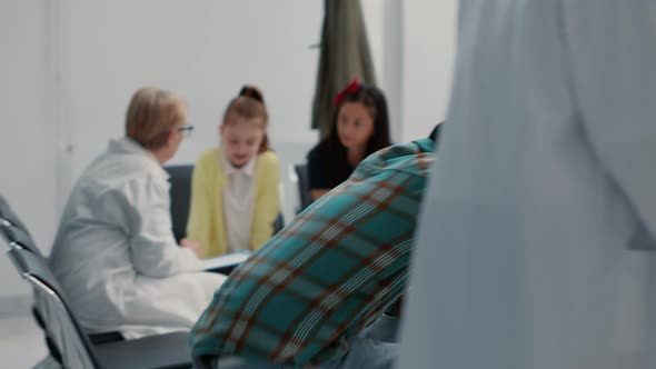 African American and Asian Patients Asking for Help with Appointments alt