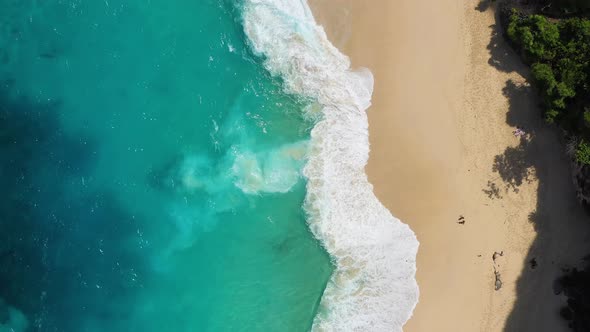 Nusa Penida island, Indonesia. Coast and waves as a background from top view. alt