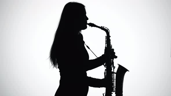 Saxophone Player. Black Silhouette on White Background