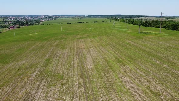 Aerial drone view of a flying over the rural agricultural landscape. alt