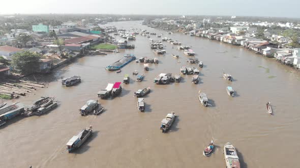 Aerial: rotating panorama over Cai Rang floating market Can Tho Vietnam alt