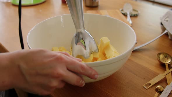 Hands Beating Butter with Immersion Blender alt