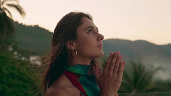 Woman Praying to God Seeking Solution to Problems alt