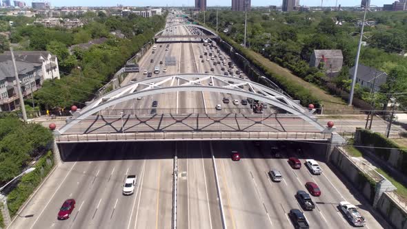 Aerial view of traffic over major freeway in Houston, Texas. This video was filmed in 4k for best im alt