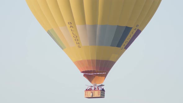 Hot Air Colorful Balloon Fly Over the White Limestone Mountains