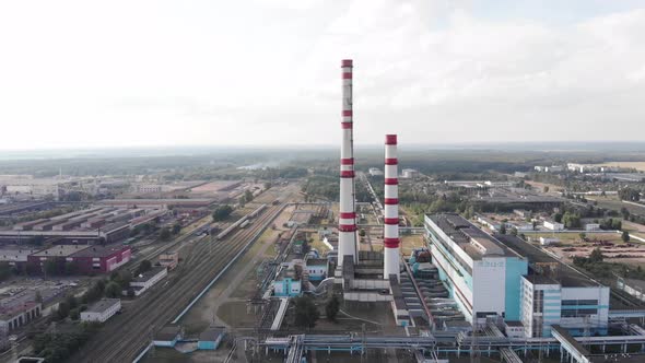 Drone Footage of a Thermal Power Plant with Industrial Buildings and Chimneys and Cooling Towers on alt