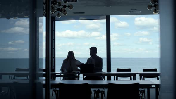 Business Couple Signing Contract at Marine View alt