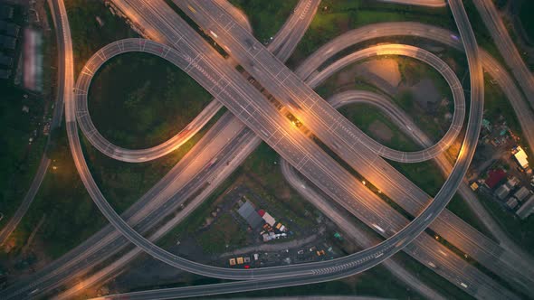 4K : Time lapse Aerial view and top view of traffic on city. Expressway with car lots alt