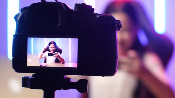 Display Camera Of Asian Kid Girl Playing Video Game With Phone Then Celebrating While Live Stream alt
