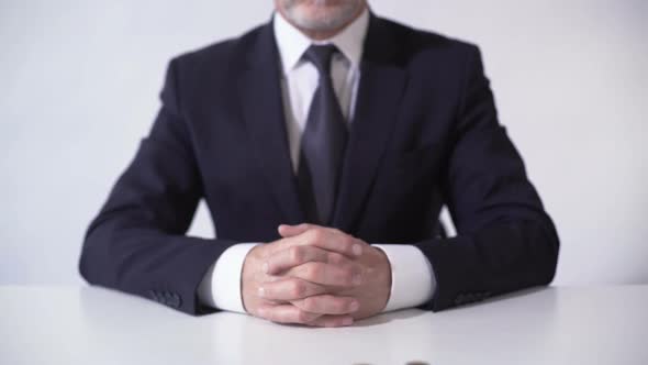 Banker Looking at Growing Income From Financial Operations, Lucrative Investment alt