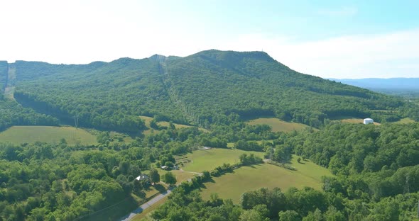 Panorama Aerial View of Summer Green Trees Forest in Daleville Town with Valley Mountains in West alt