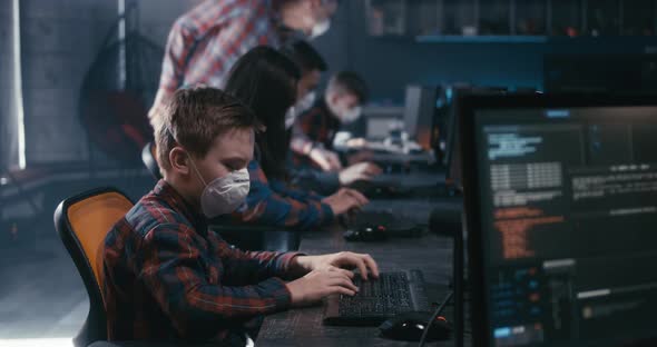 Student and Teacher Discussing Programming in School alt