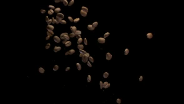 A Coffee Beans Falling in Slow Motion Isolated on Black Background