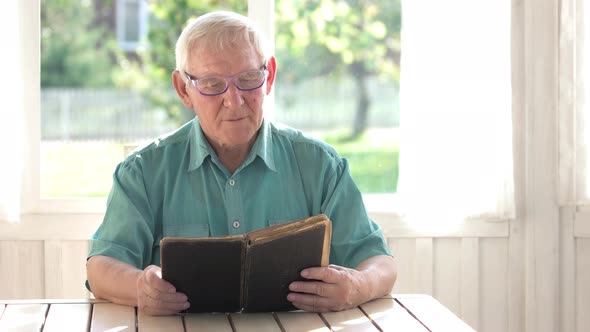 Senior Man Reading a Book. alt