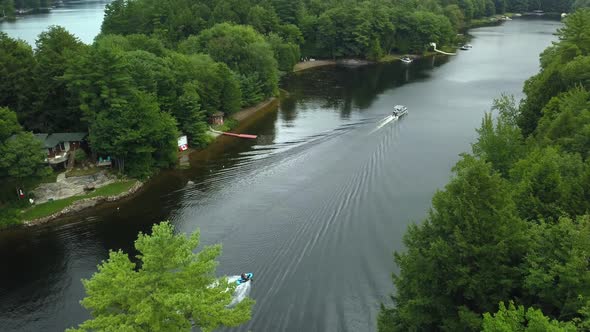 Aerial view of seadoo riding down Muskoka river in cottage country alt