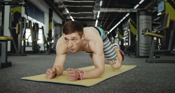 Sportsmen Doing Exercise on His Feet