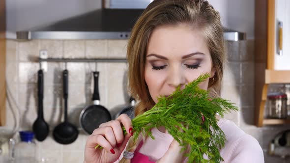 Girl Smelling Dill Herb