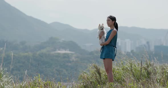 Woman go hiking with her dog