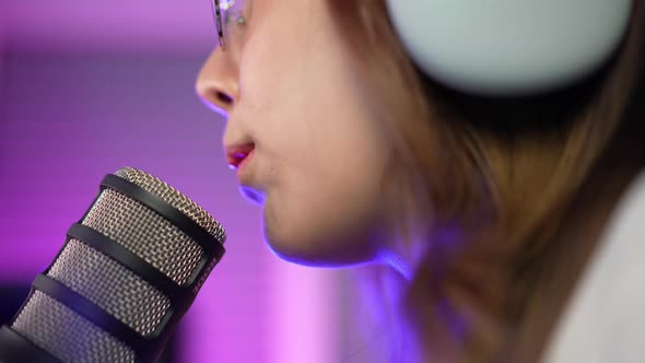 Gamer and E-Sport online of Asian woman playing online computer video game with lighting effect alt