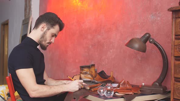Serious Cobbler Engaging in Shoe Making Process