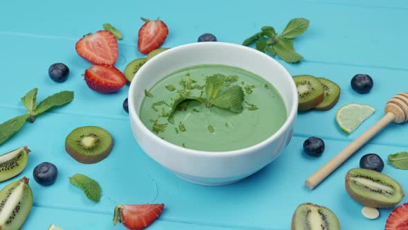 Healthy Breakfast Smoothie Bowl Topped with Fruits Berries and Kiwi alt