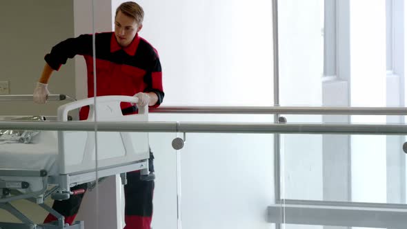 Doctor and paramedics rushing a patient in emergency alt