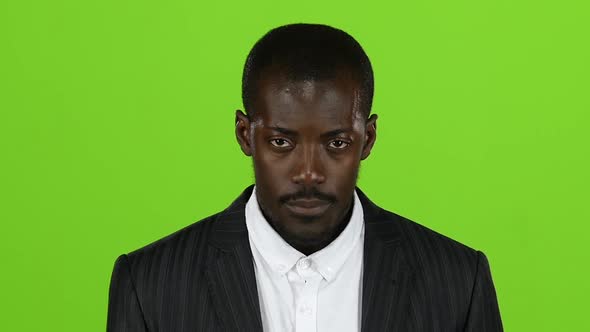 African American Raises His Gaze and Looks. Green Screen. Slow Motion alt