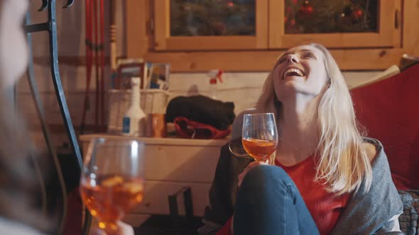 Young Women Best Friends Having a Drink and Celebrating Winter Holidays alt