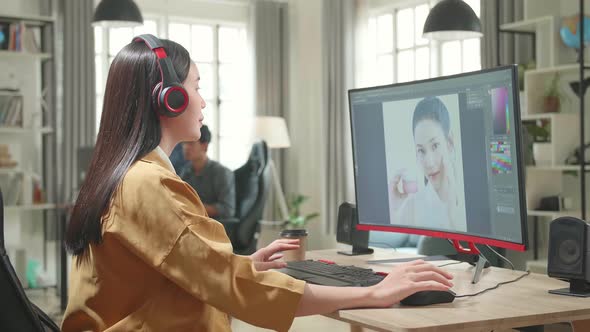 Asian Female Digital Editor Start Works In Photo Editing Software On Her Personal Computer In Office alt