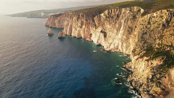 Aerial drone view of the Ionian Sea coast of Zakynthos, Greece. Rocky cliffs, vegetation alt