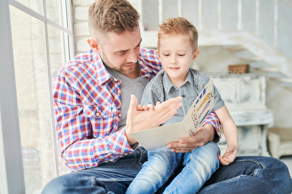 Handsome Man Playing with Son - Stock Photo - Images
