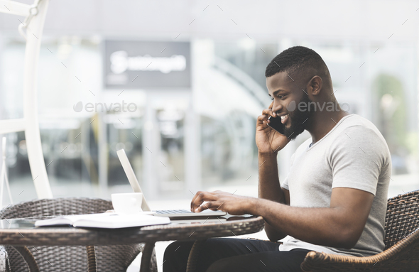 African guy talking with friend and planning the date of party