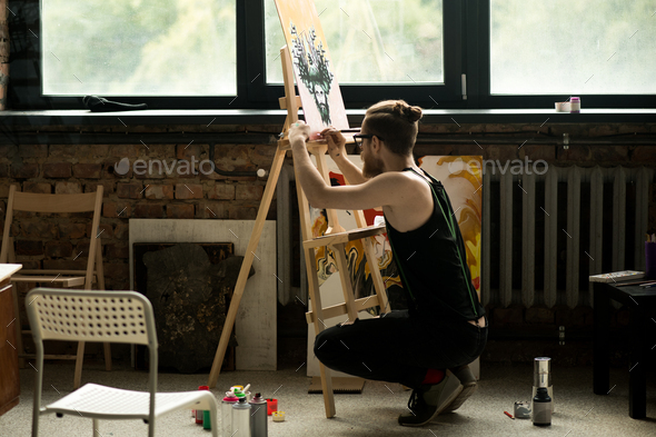 Modern Artist Painting on Easel - Stock Photo - Images