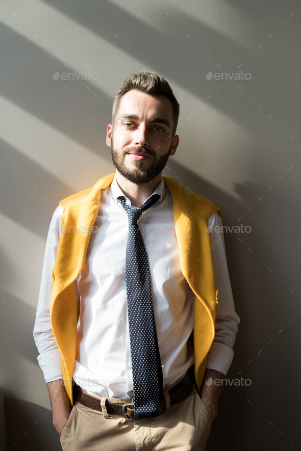 Handsome Man Posing against Wall - Stock Photo - Images