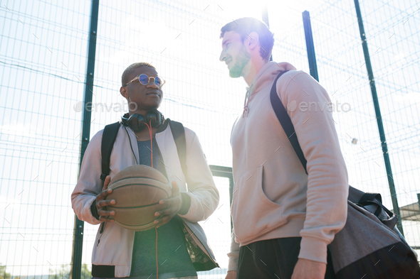 Two Young Men in Outdoor  Basketball Court - Stock Photo - Images