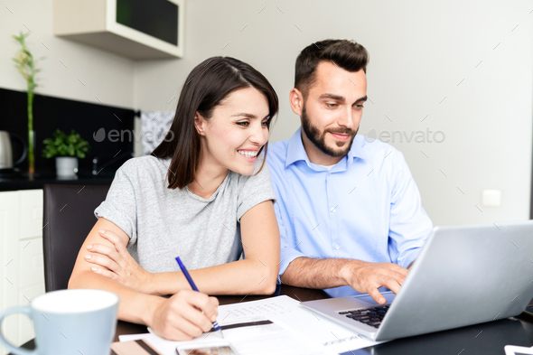Couple filling tax return form - Stock Photo - Images