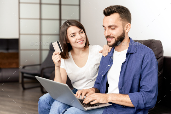 Couple buying furniture on internet