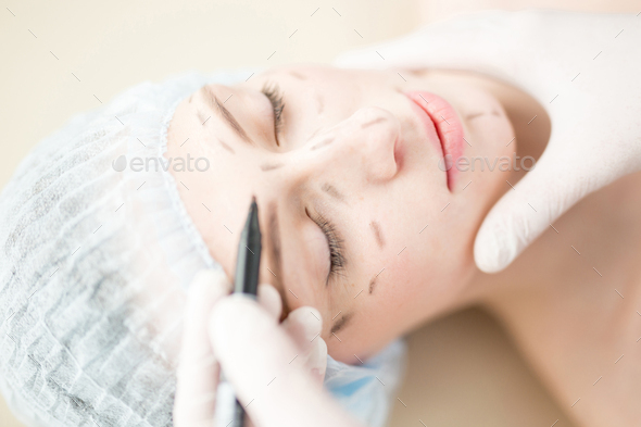 Making marks on face - Stock Photo - Images