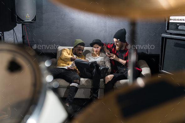 Music Band Chilling in Studio