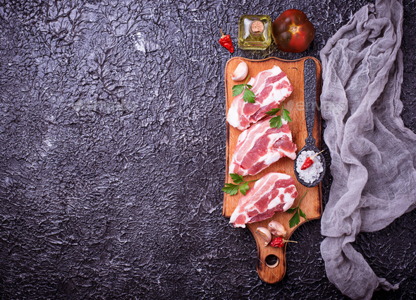 Raw pork meat and ingredients for cooking - Stock Photo - Images