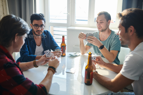 Friends playing cards - Stock Photo - Images