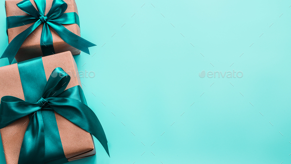 Gift boxes in craft paper and satin ribbon, banner - Stock Photo - Images