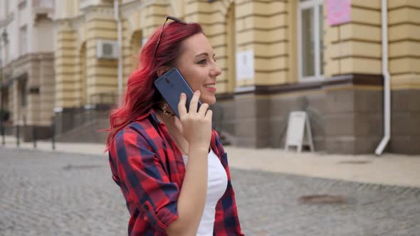 Red Hair Girl Speaks Smartphone