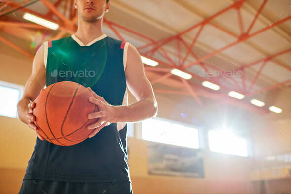 Crop man on basketball court - Stock Photo - Images