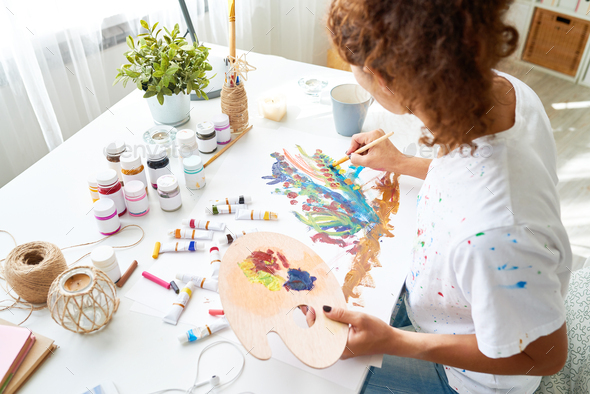 Creative Young Woman Painting Pictures - Stock Photo - Images