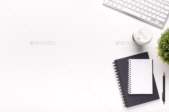 Black and white notepads, keyboard and plant on office table Stock ...