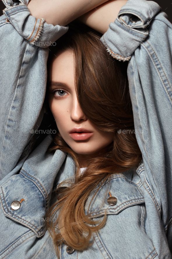Sensual Female Model Posing in Denim Jacket, Jeans and White Socks on the  Floor near Beige Wall. Back to 1990s Fashion Lifestyle Style Concept. Stock  Photo | Adobe Stock