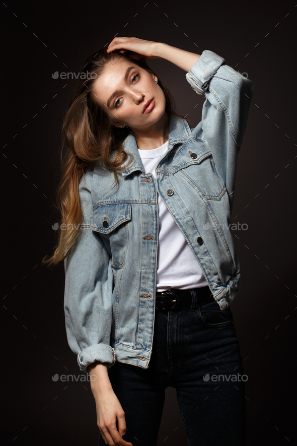 Beautiful Girl Fashion Pose Jeans Purple Shirt Stock Photo by ©Fotosmurf  222621836