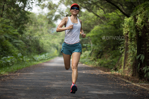 Fitness woman runner running on summer park in the morning Stock Photo by  lzf